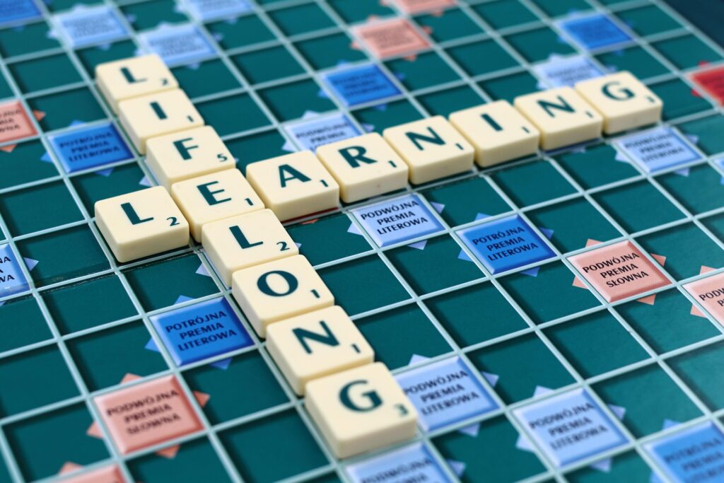 Letters on a scrabble board spell out lifelong learning.
